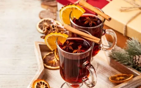 mulled wine on a tray with orange slices